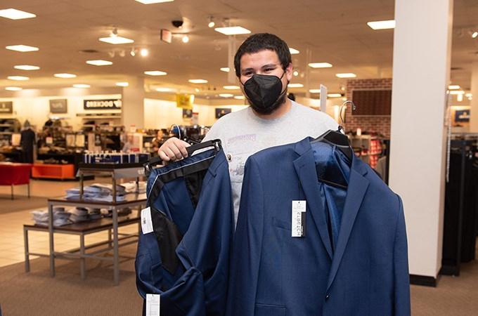 With the help of a scholarship, Carlos Chavez ’23 purchased new business attire at the recent Suit-Up event, co-hosted by the University of Redlands Office of Career and Professional Development and JCPenney. (Photo by Coco McKown '04, '10)